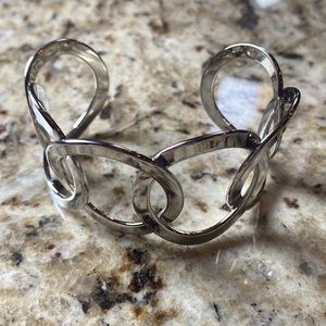 Metal silver color cuff bracelet. 8 in. circ. Circle design Never tarnishes.